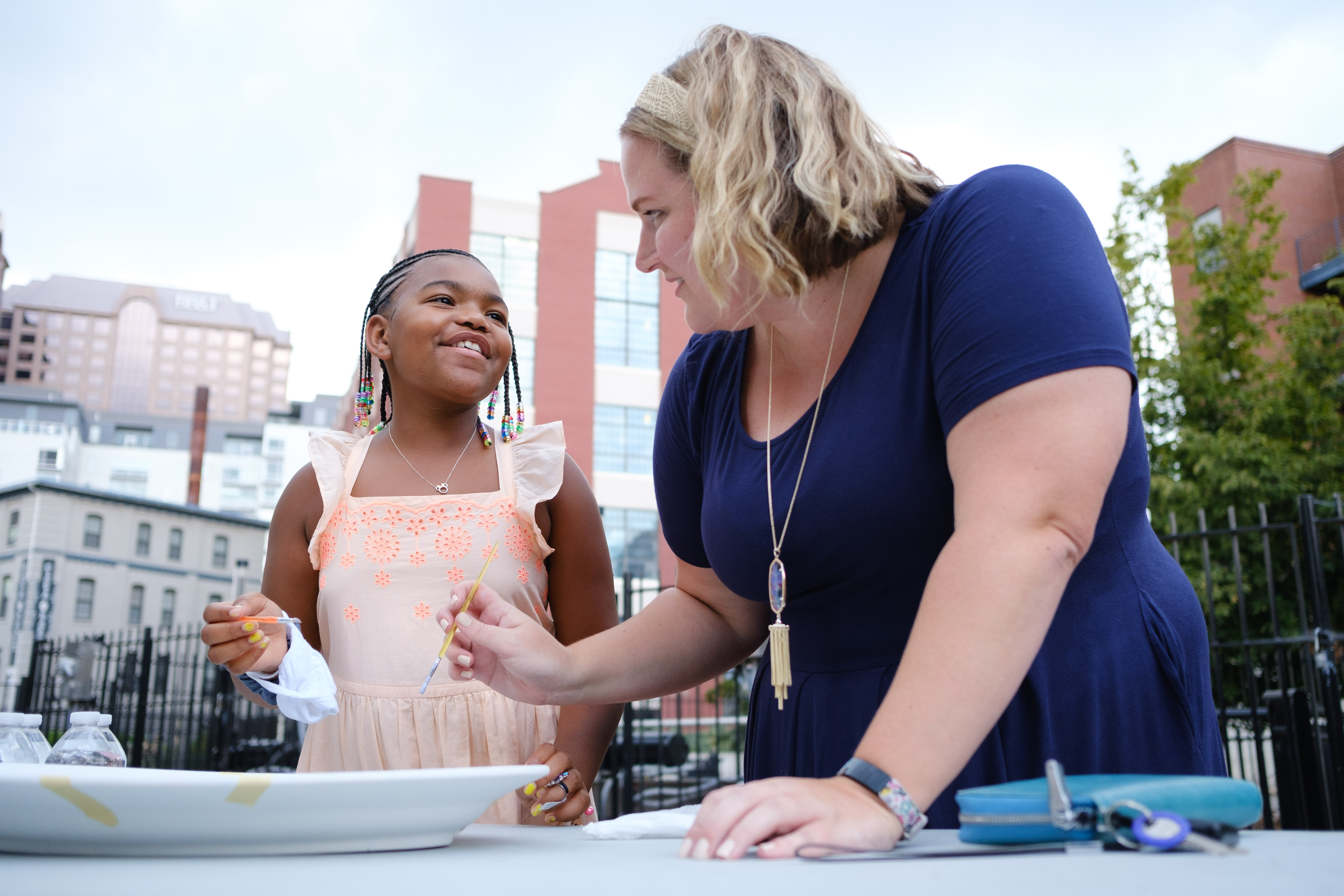 Big and Little interacting outside, Big Brothers Big Sisters mentoring