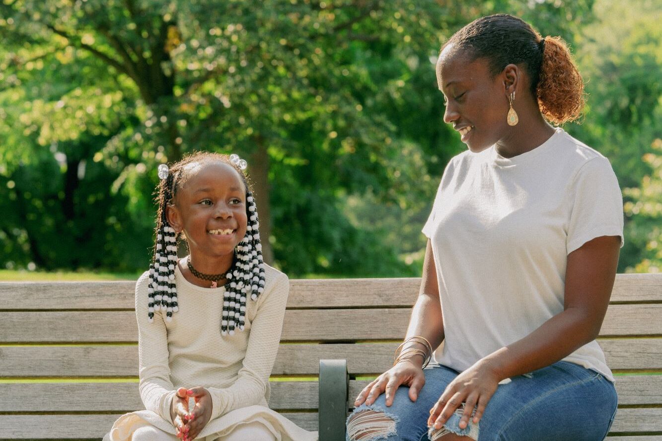 Big and Little interacting outside, Big Brothers Big Sisters mentoring